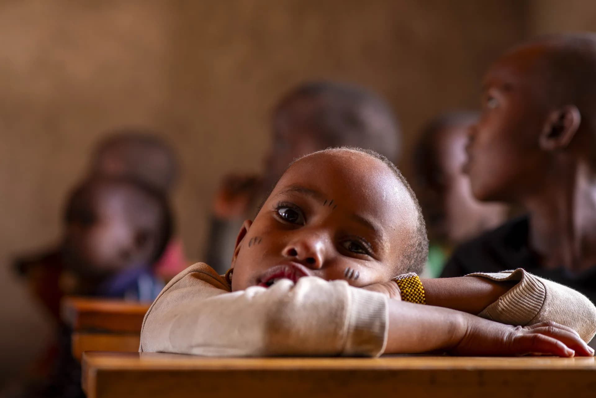 A child at a community school desk