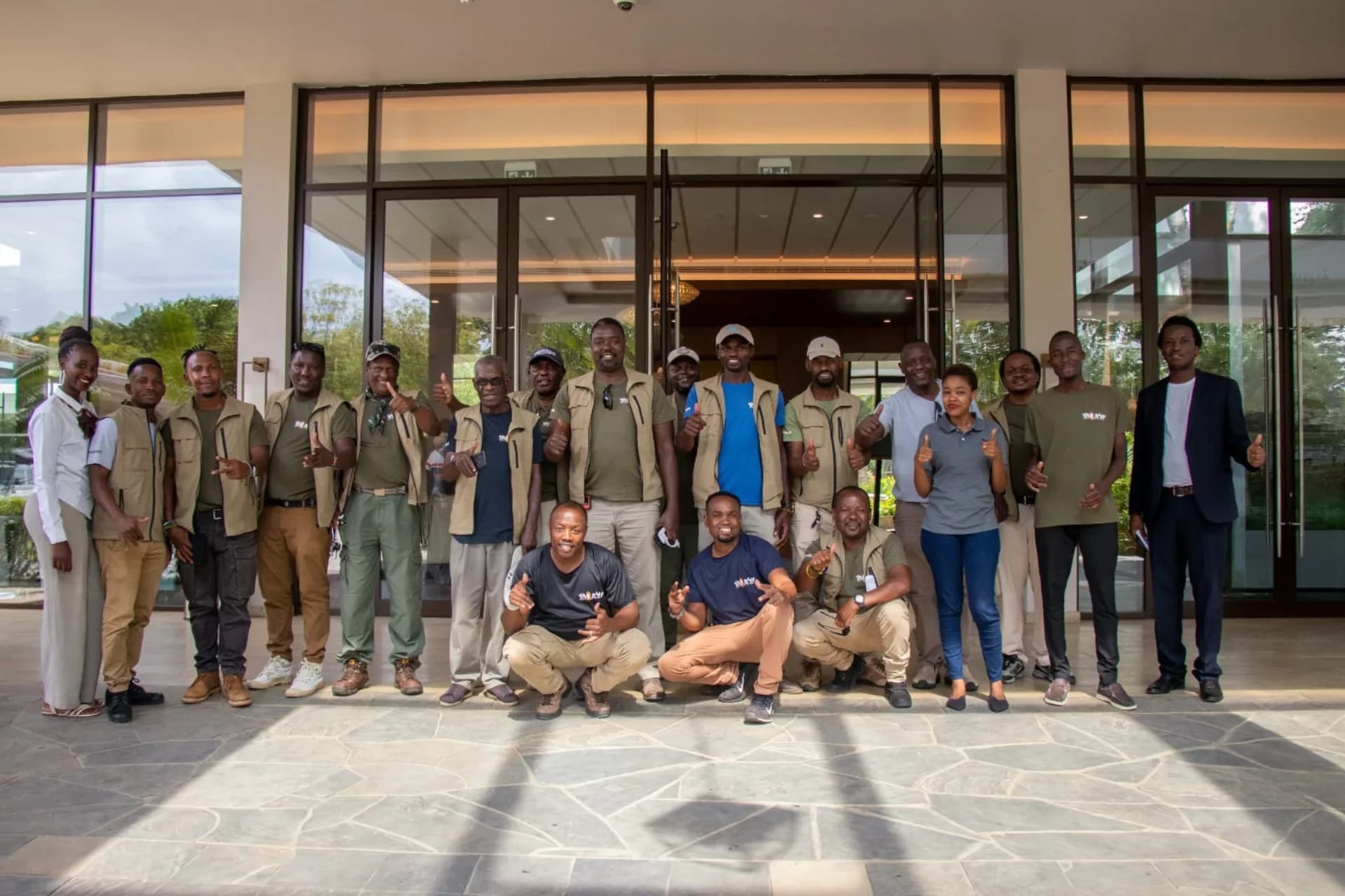 A full team group photo on safari