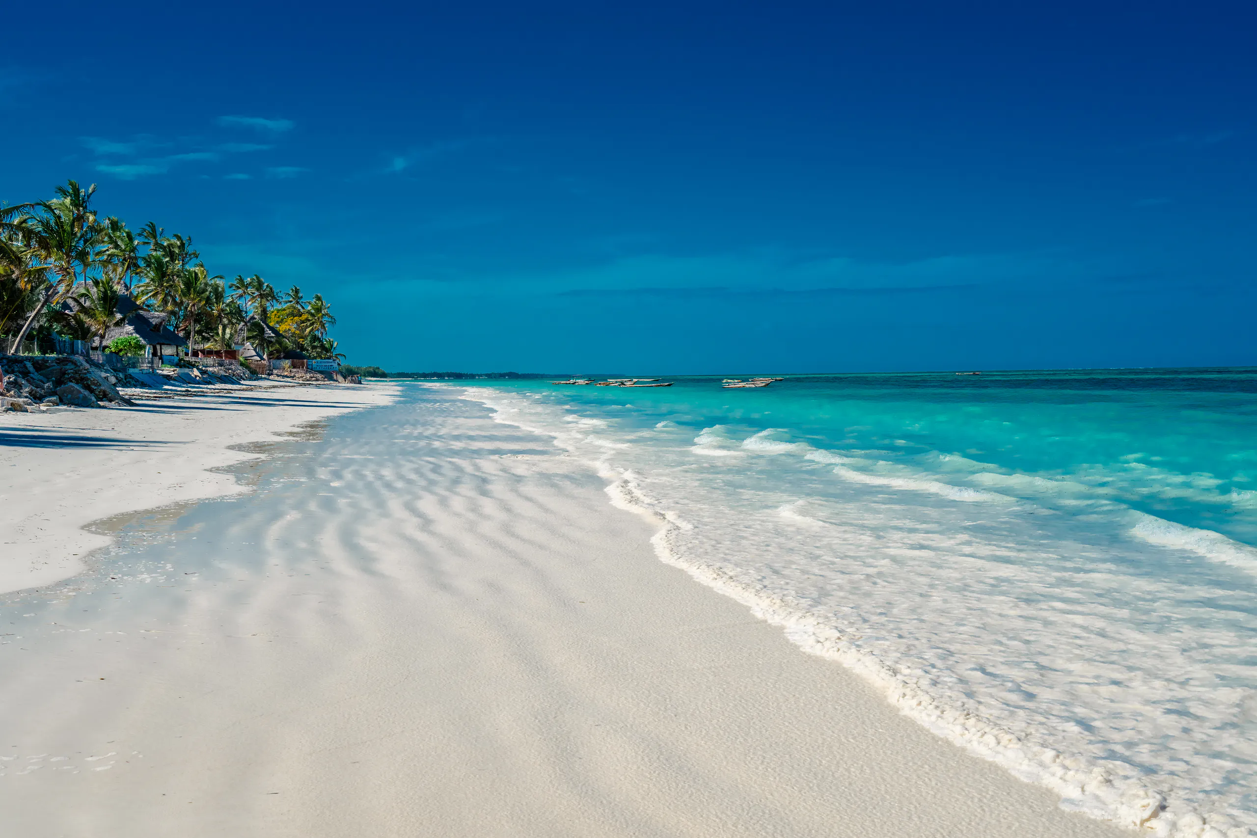 Turquoise water over white sand on a Zanzibar beach